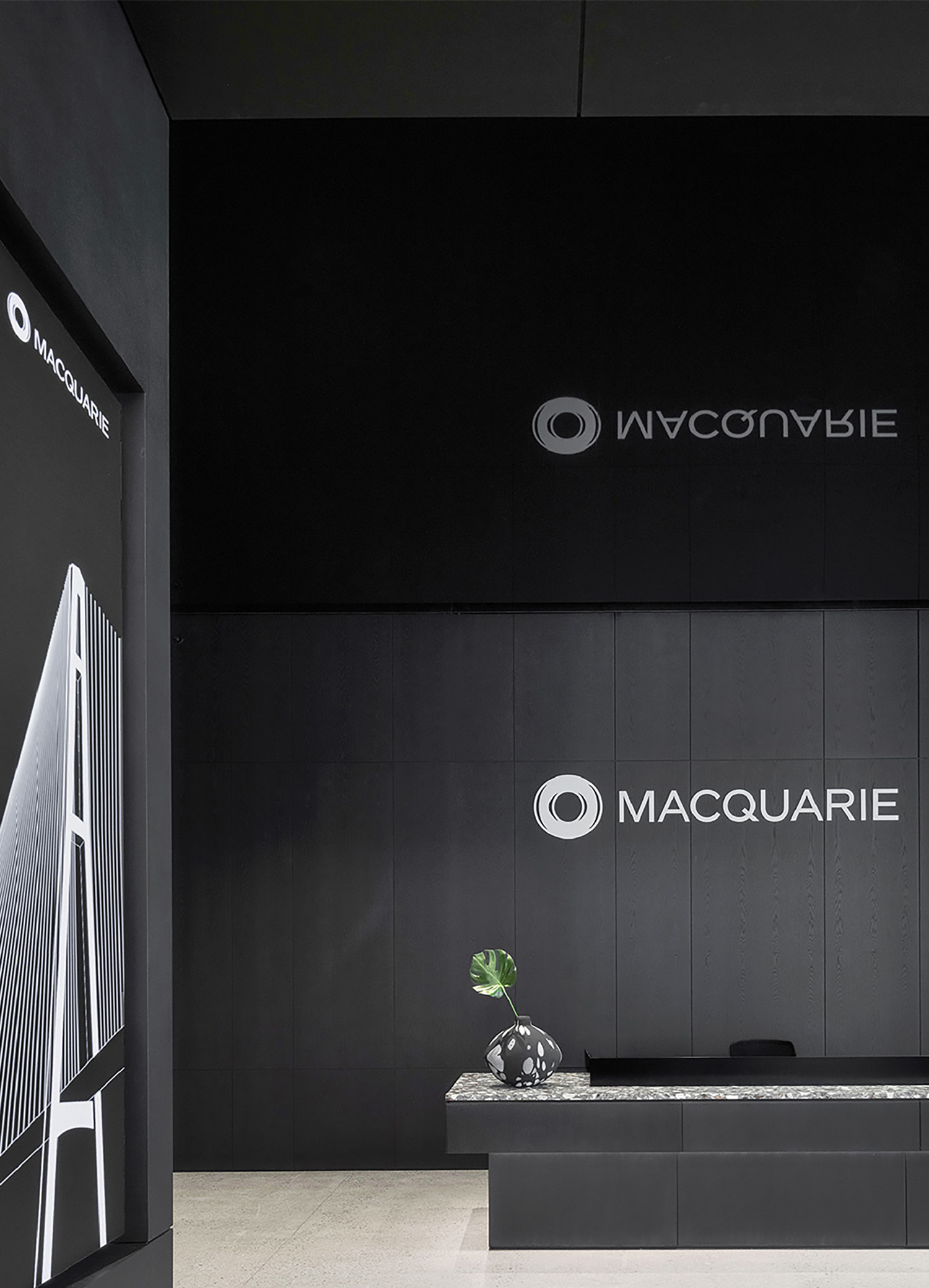 A black and white room with a large sign.
