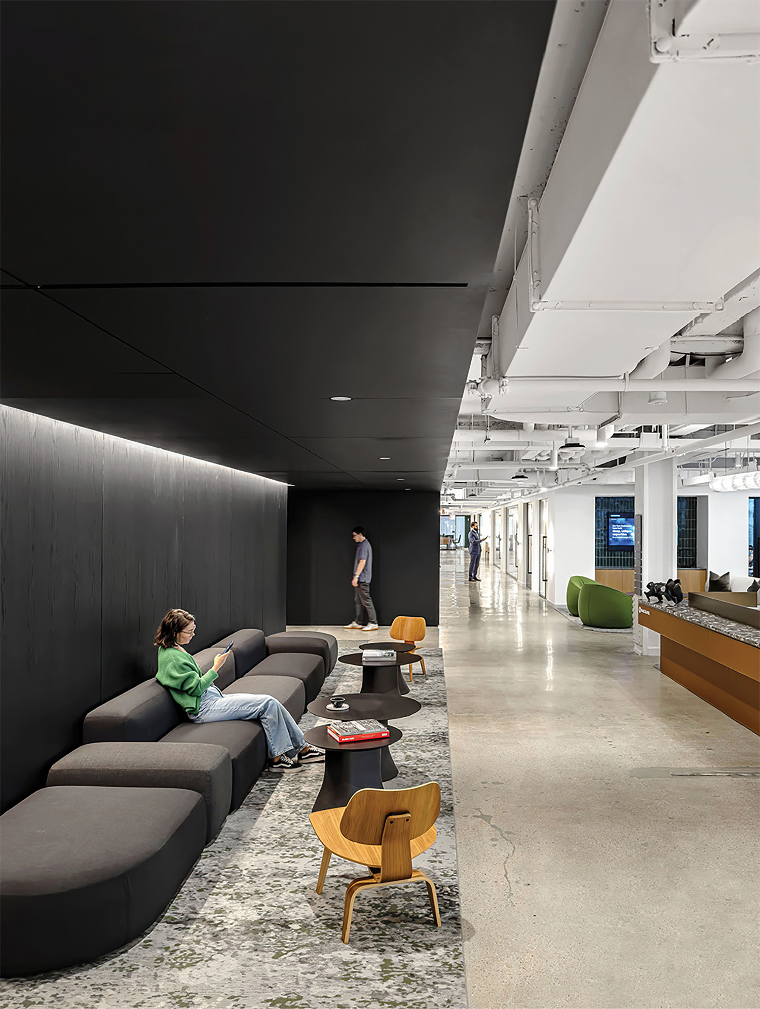 A long couch in a large room.