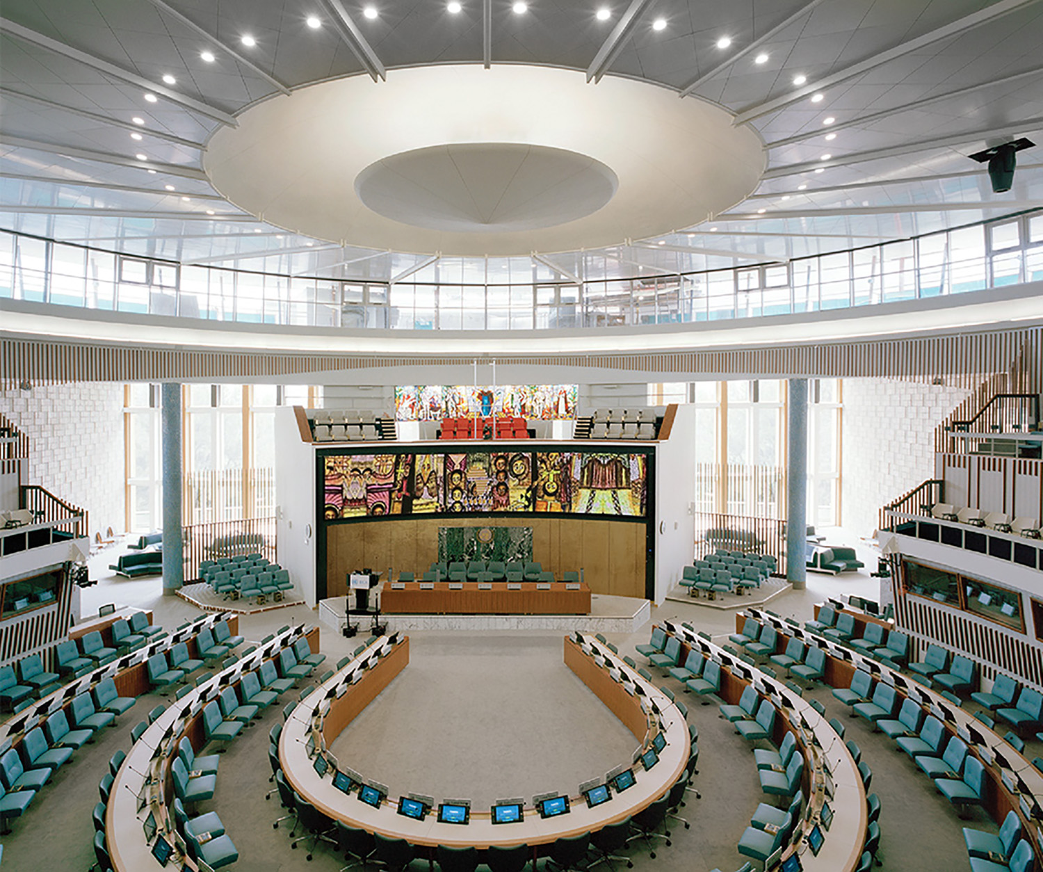 A large circular room with a large screen.