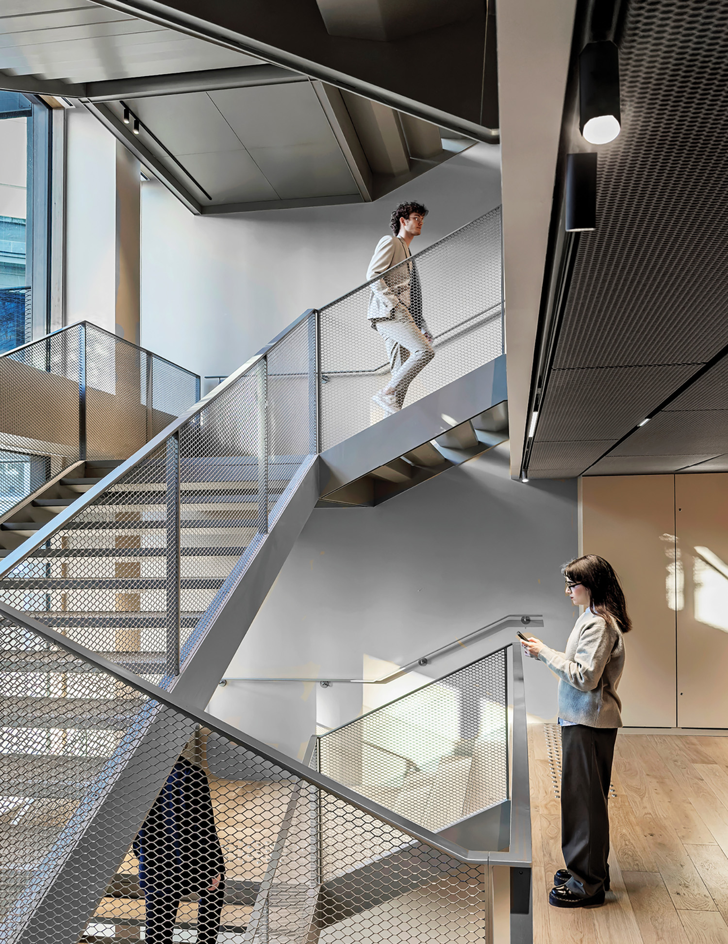 A woman is walking up a set of stairs.