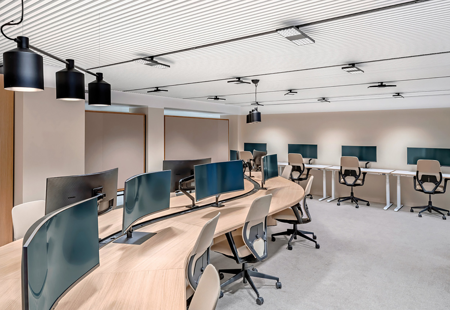 A room with a lot of desks and chairs.