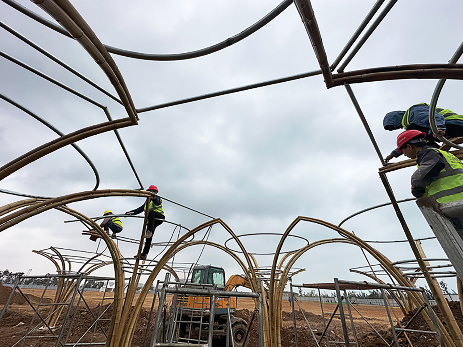 people building fabricated steel pipes