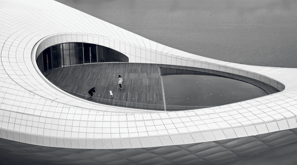 A white building with a circular window.