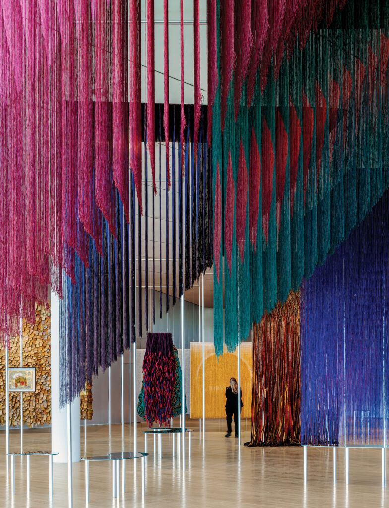 A large room with a large colorful sculpture.