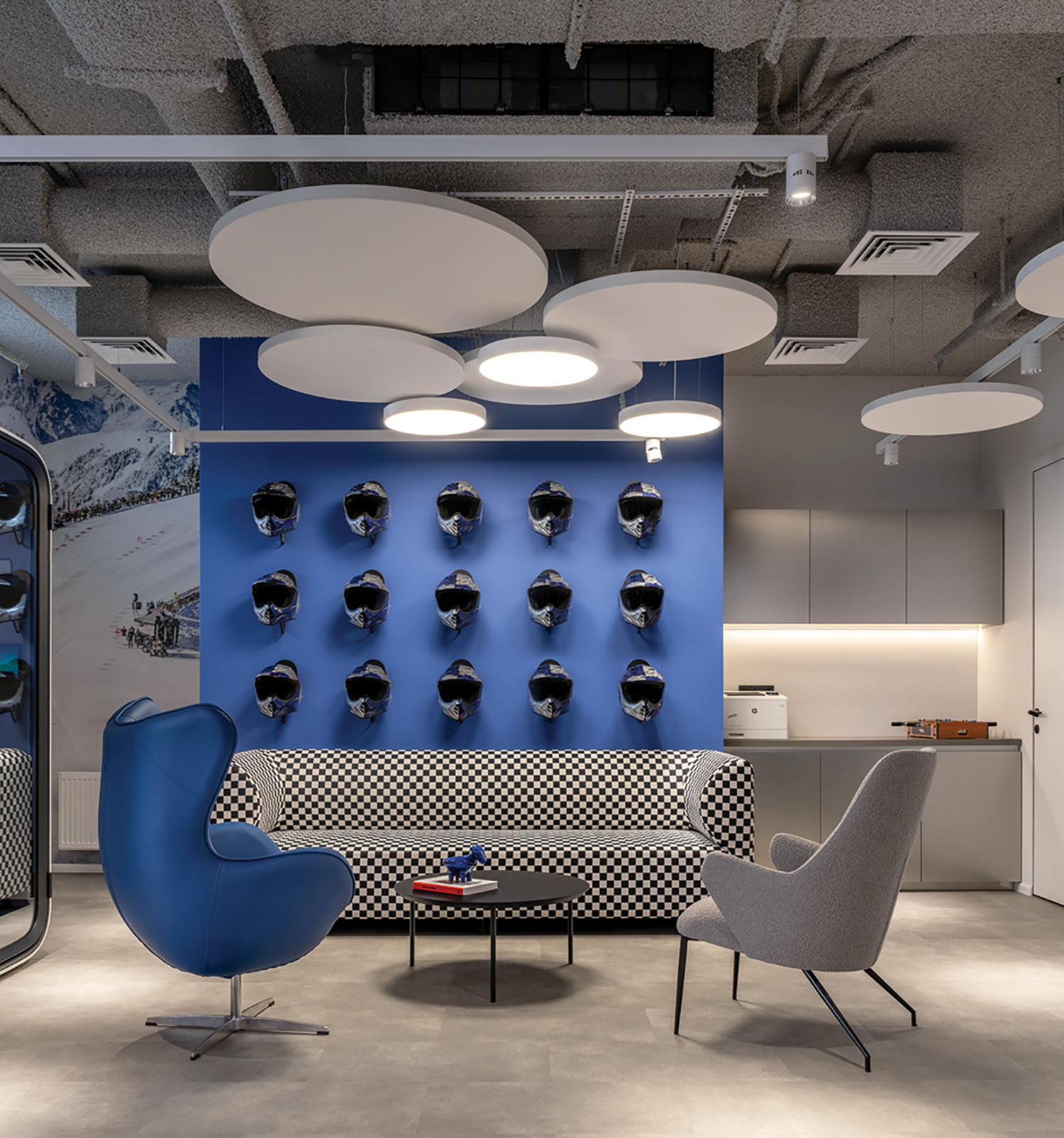 A room with a blue wall and a white ceiling.