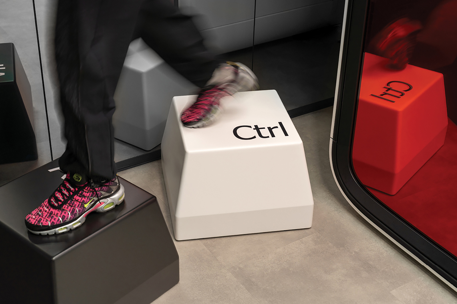 A person walking on a box with a pair of shoes.