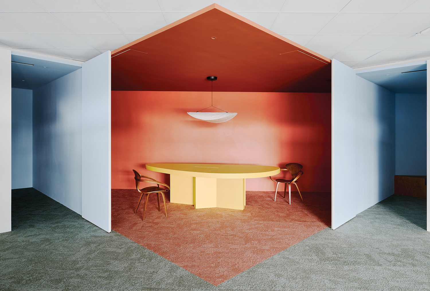 A room with a table and chairs in it.