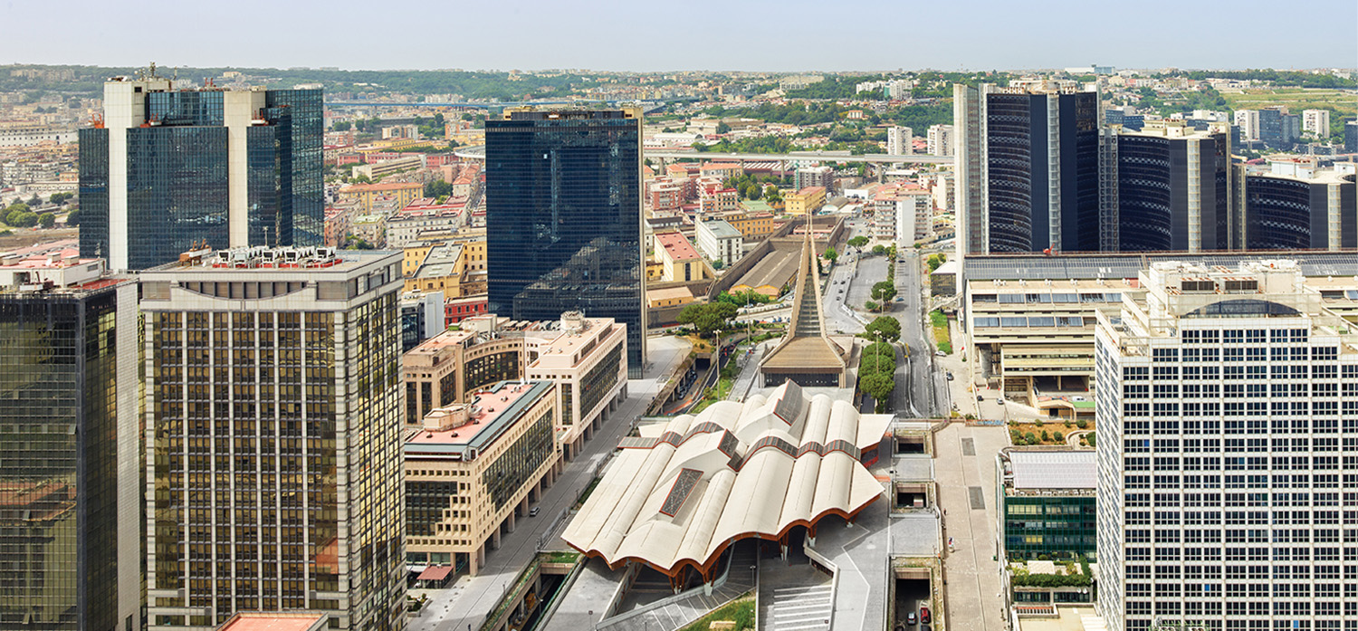 A city with tall buildings and a lot of cars.