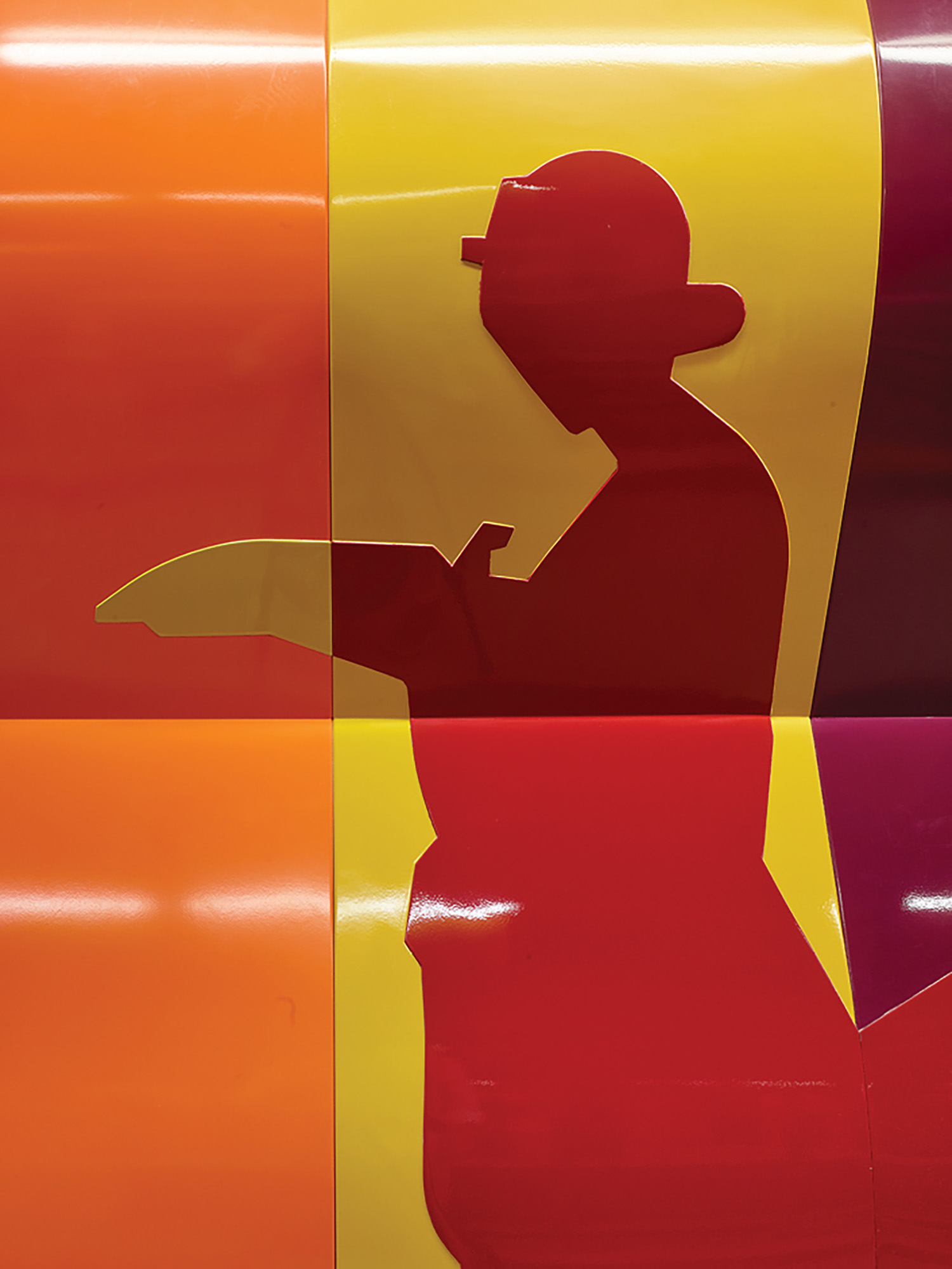 A person in a hat and a red shirt.
