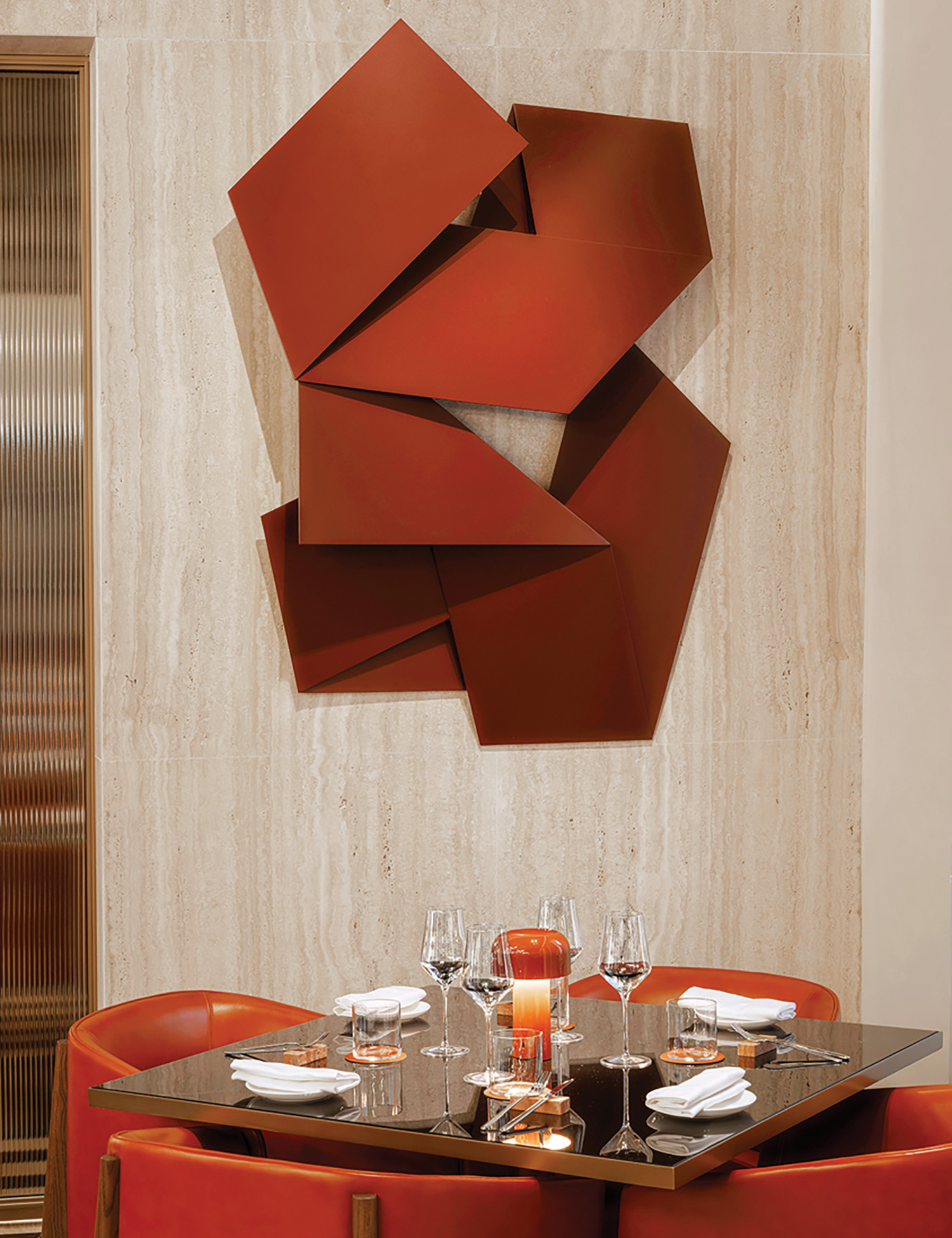 dining area with a wall sculpture