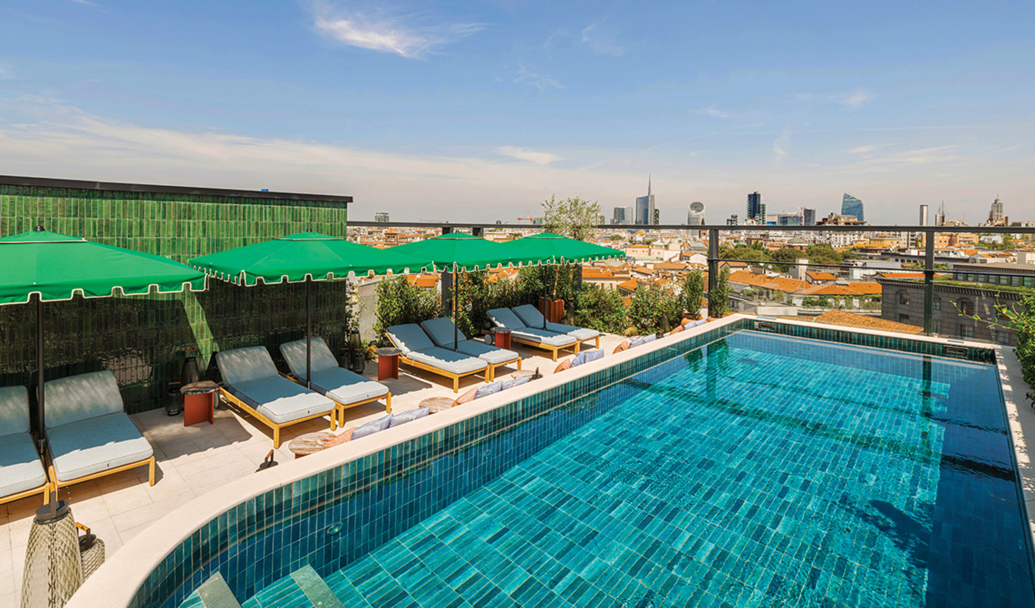 A pool with a view of a city.