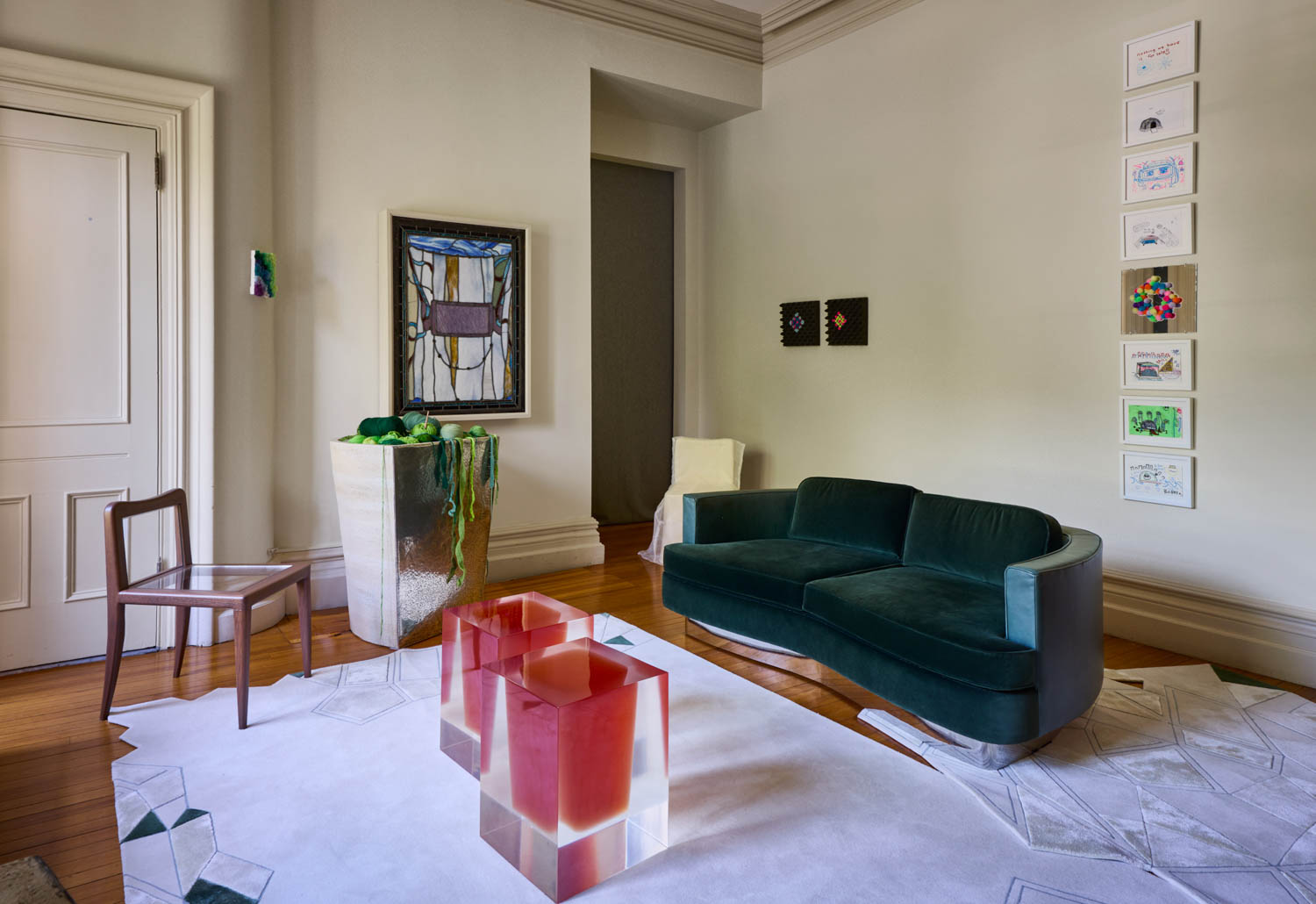 a blue sofa in the exhibit space