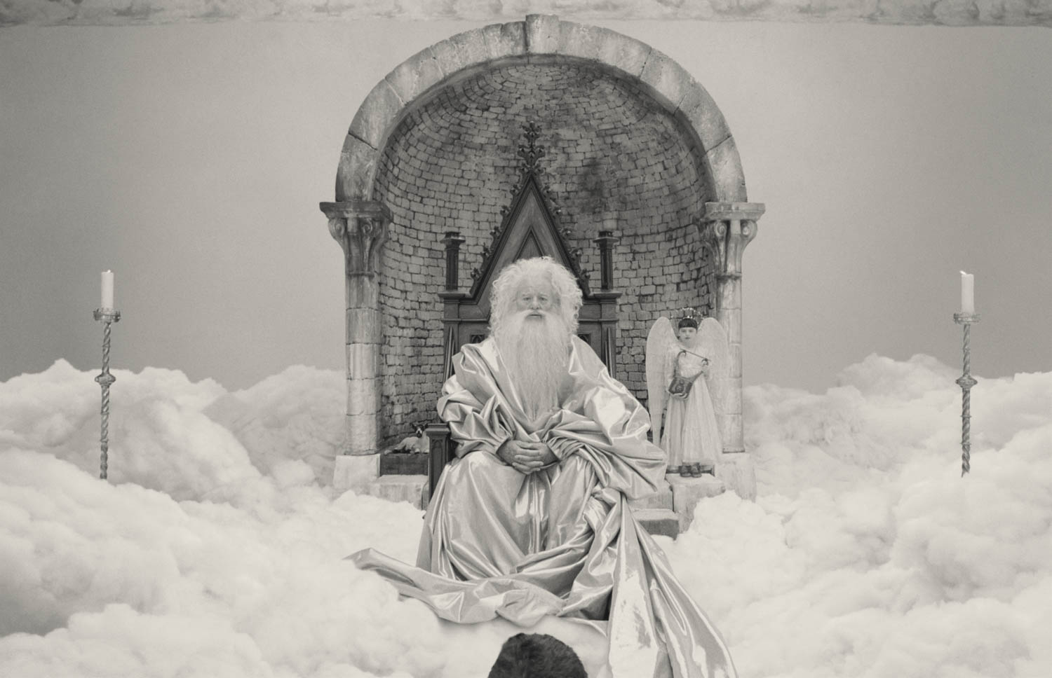 God sitting amongst the clouds