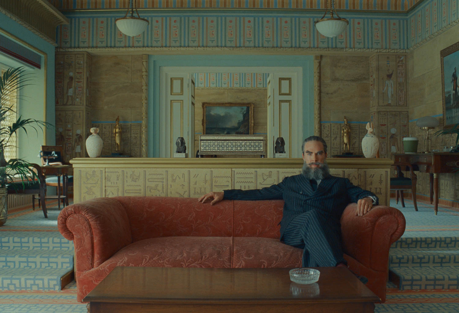 person sitting on a long couch