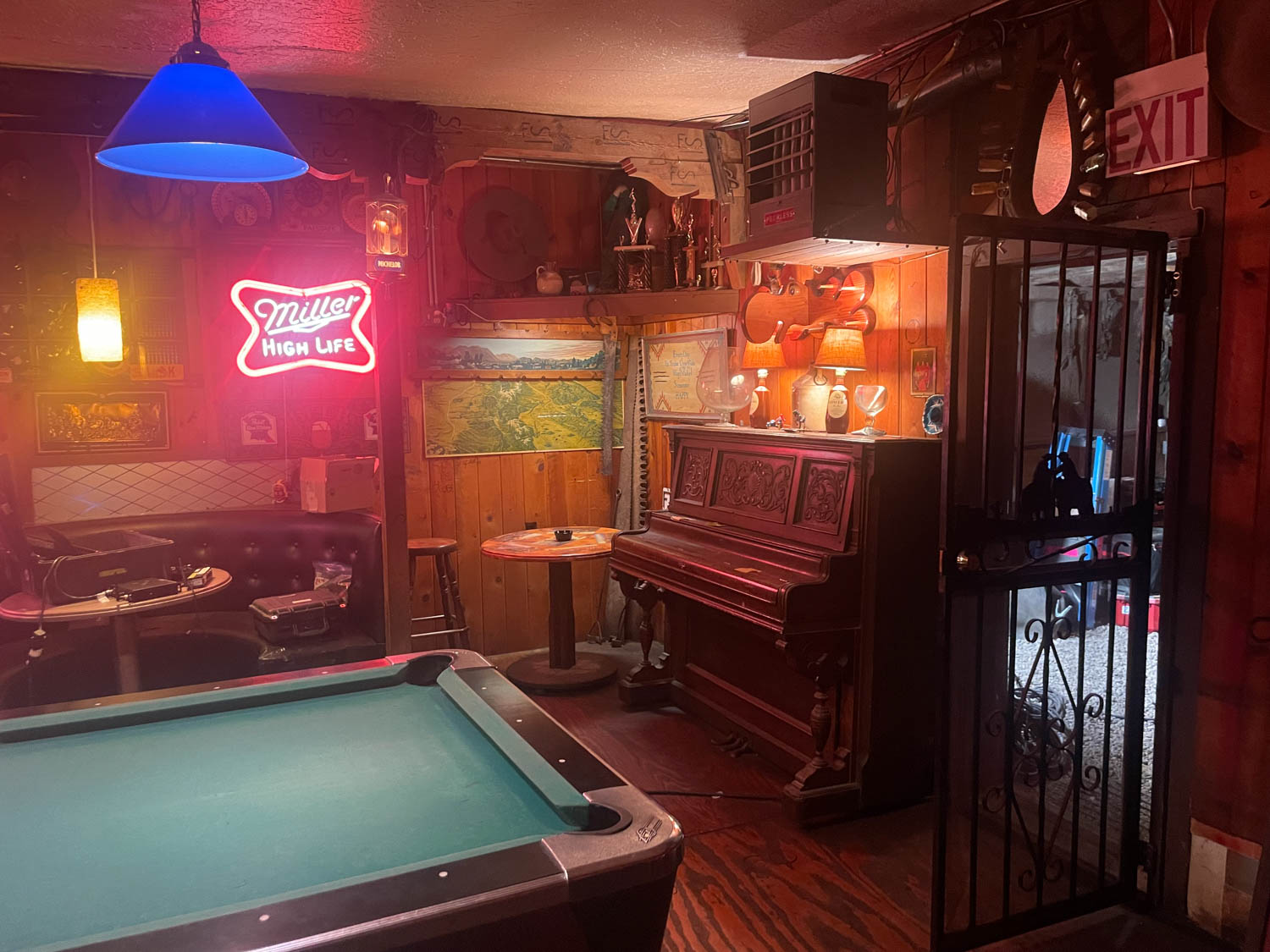 interior of bar with pool table and tables