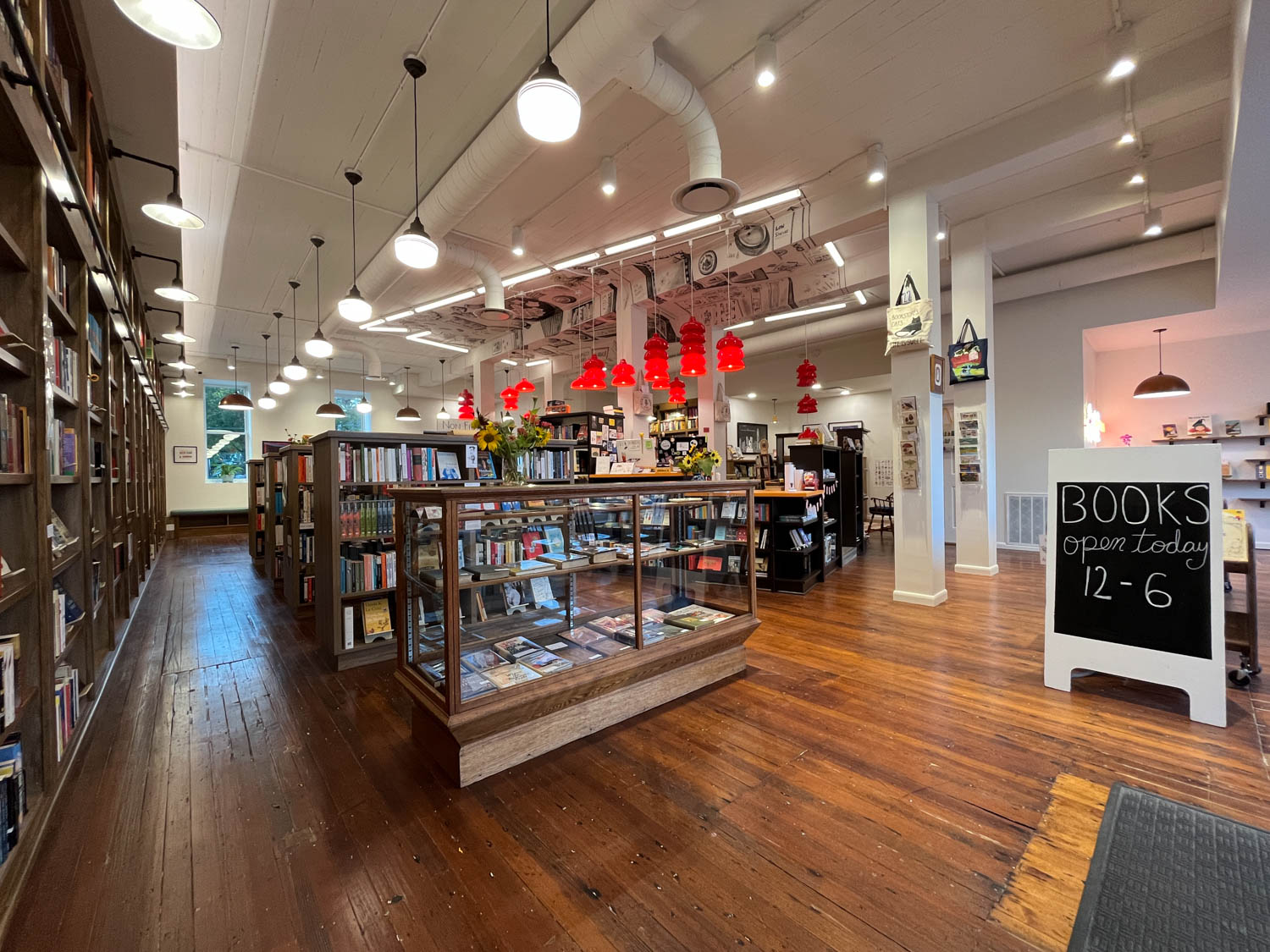 bookstore interior with multiple lights and wooden floors