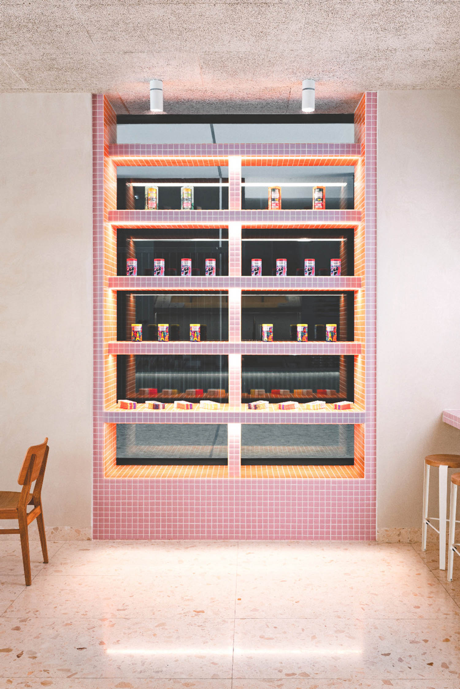pink tile shelf with items