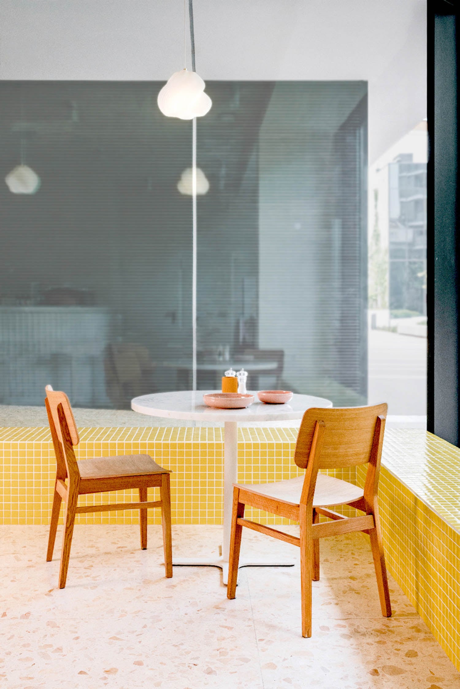 corner nook of the cafe with wooden chairs