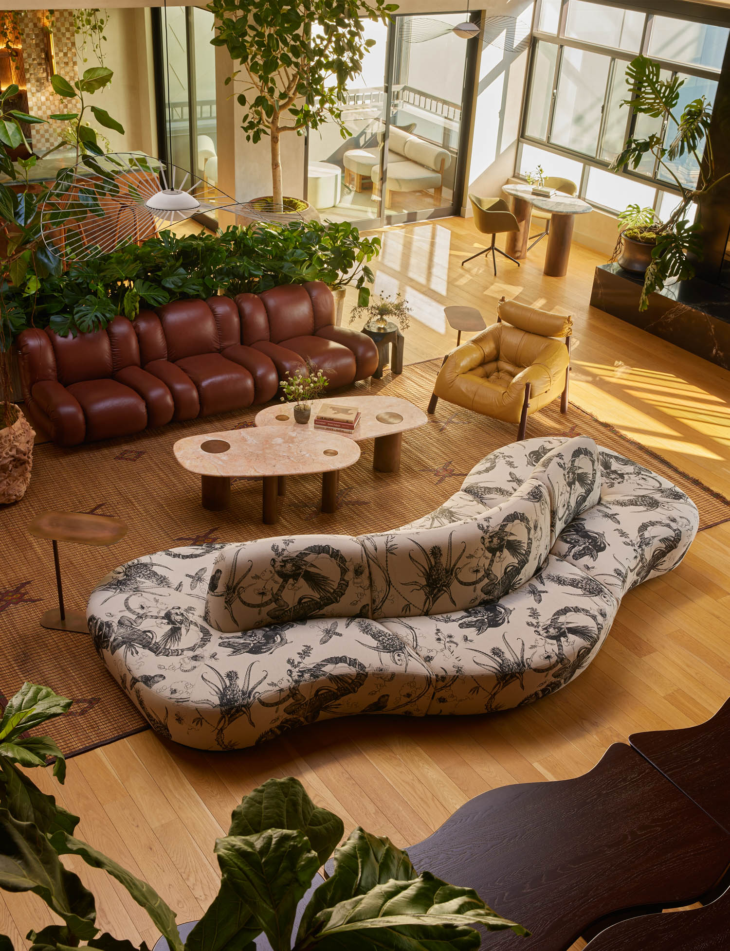 aerial view of lounge area with botanical print sofa