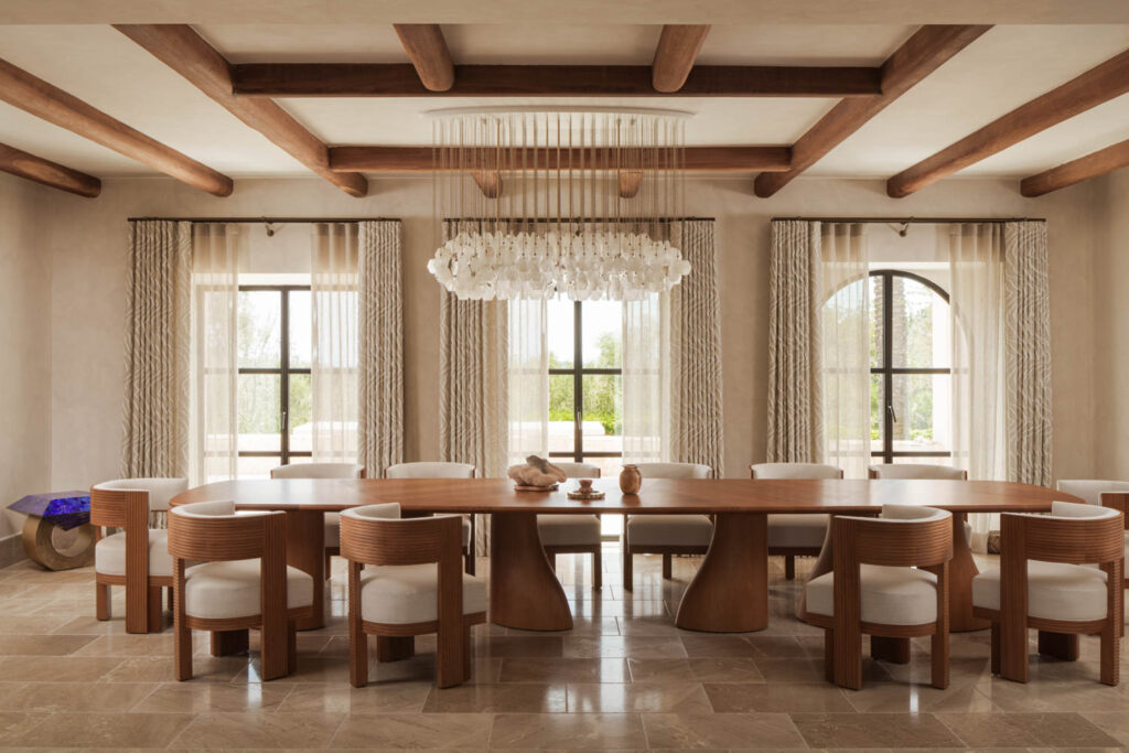 dining room with wooden chairs and sculptural chandelier