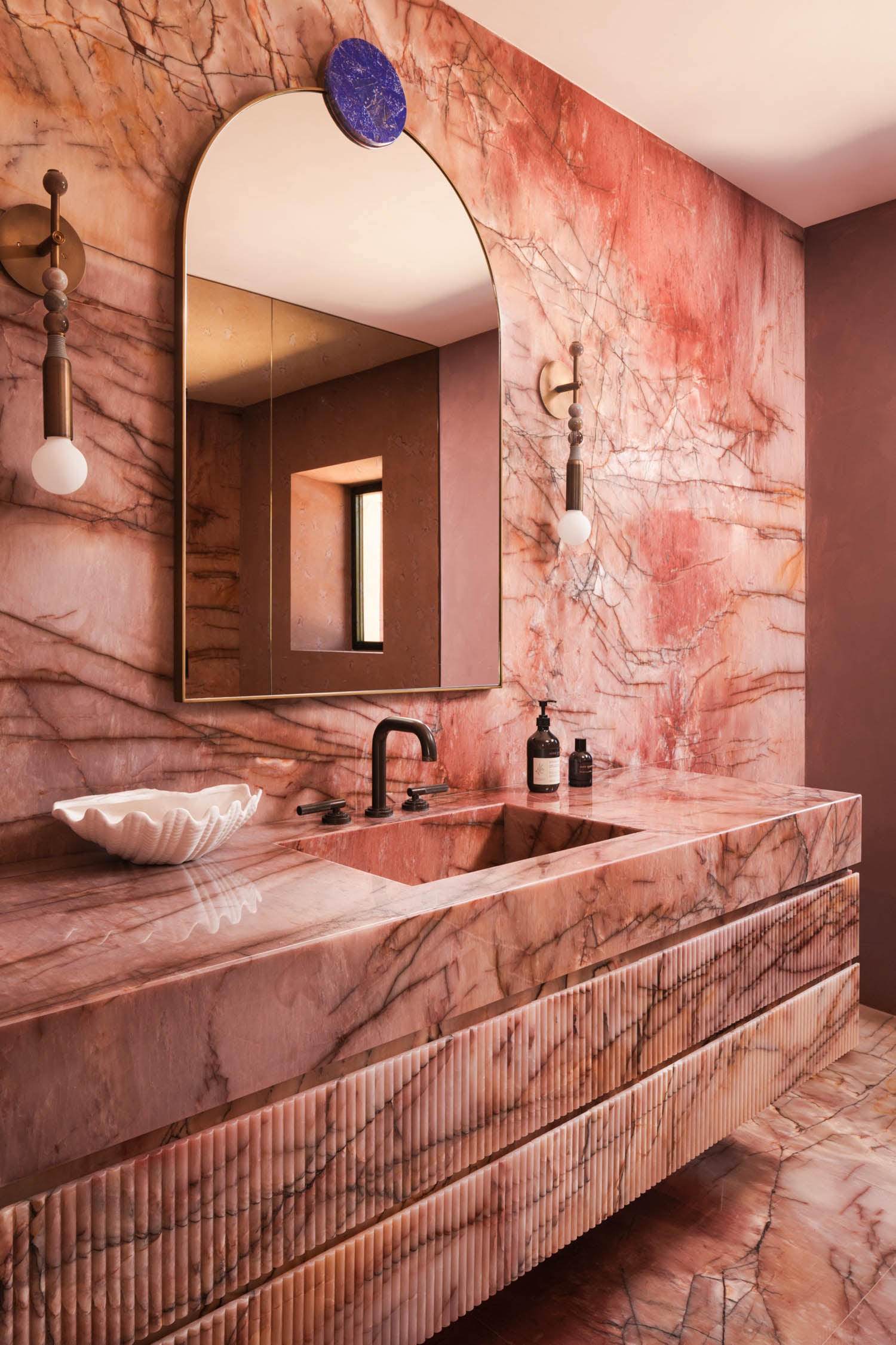 jewel box bathroom with pink marble