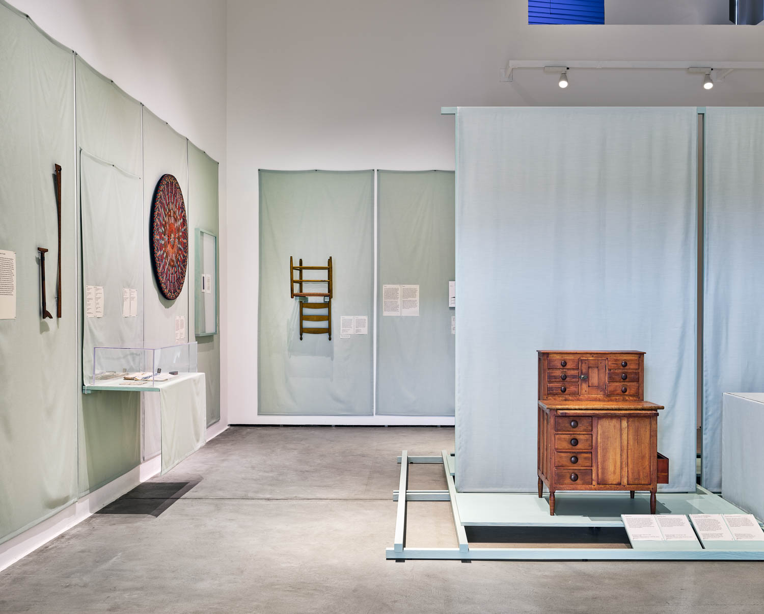 exhibit room with shaker style table and lots of other things