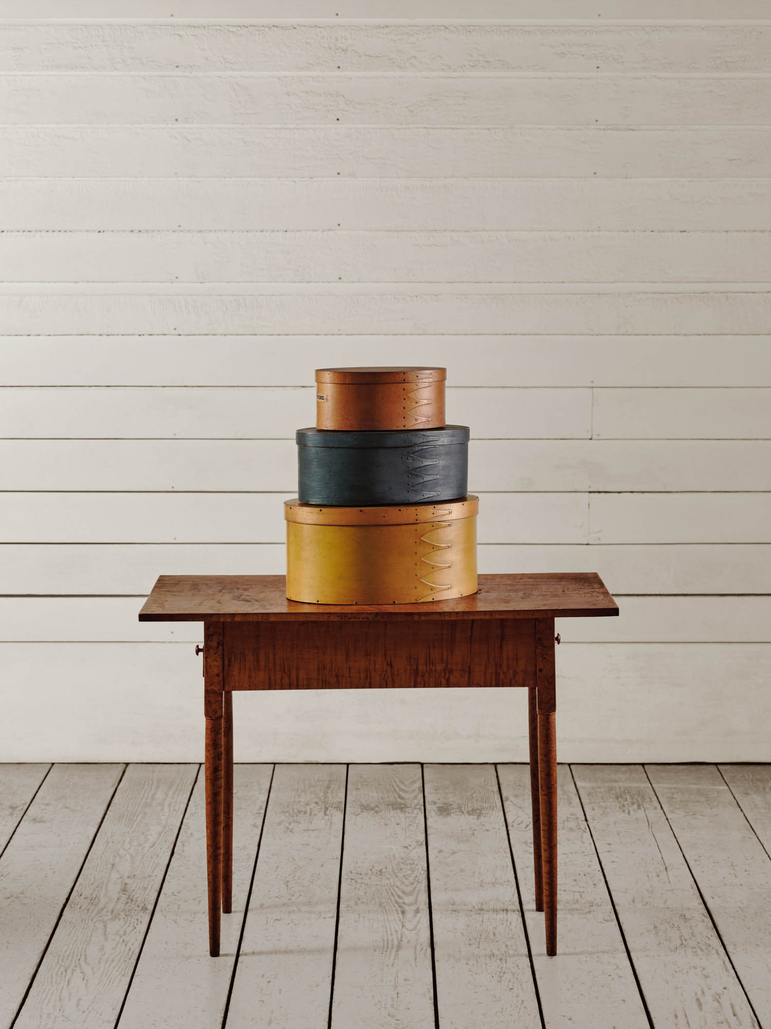 shaker style oval boxes on a desk