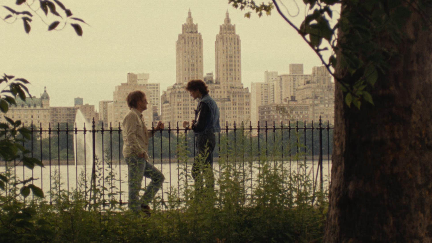 two men talking outside