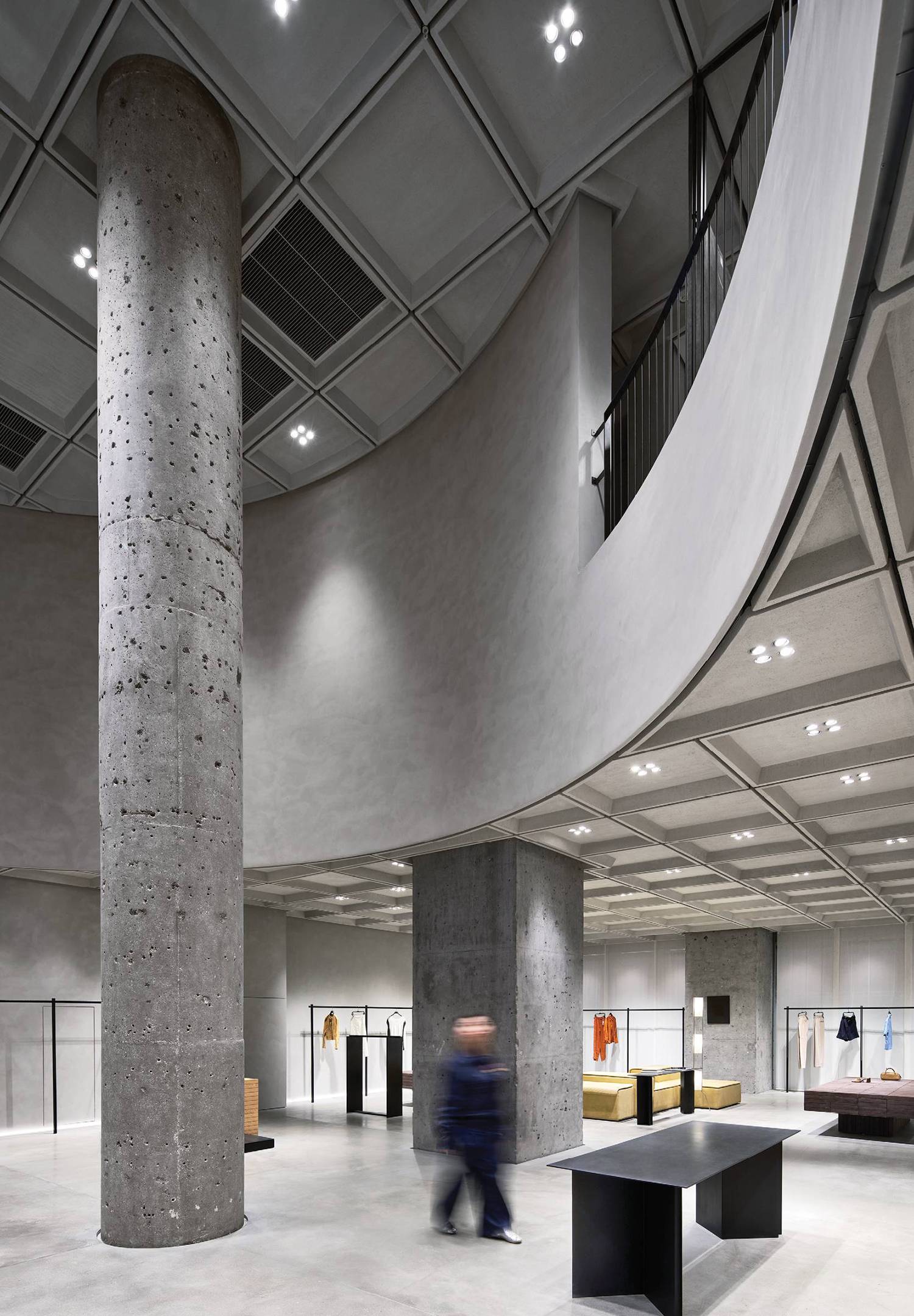 A large room with a large column in the middle