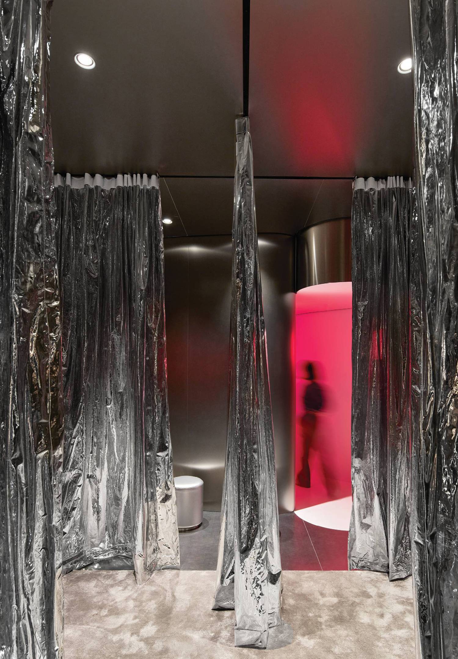 A room with a red wall and a mirror