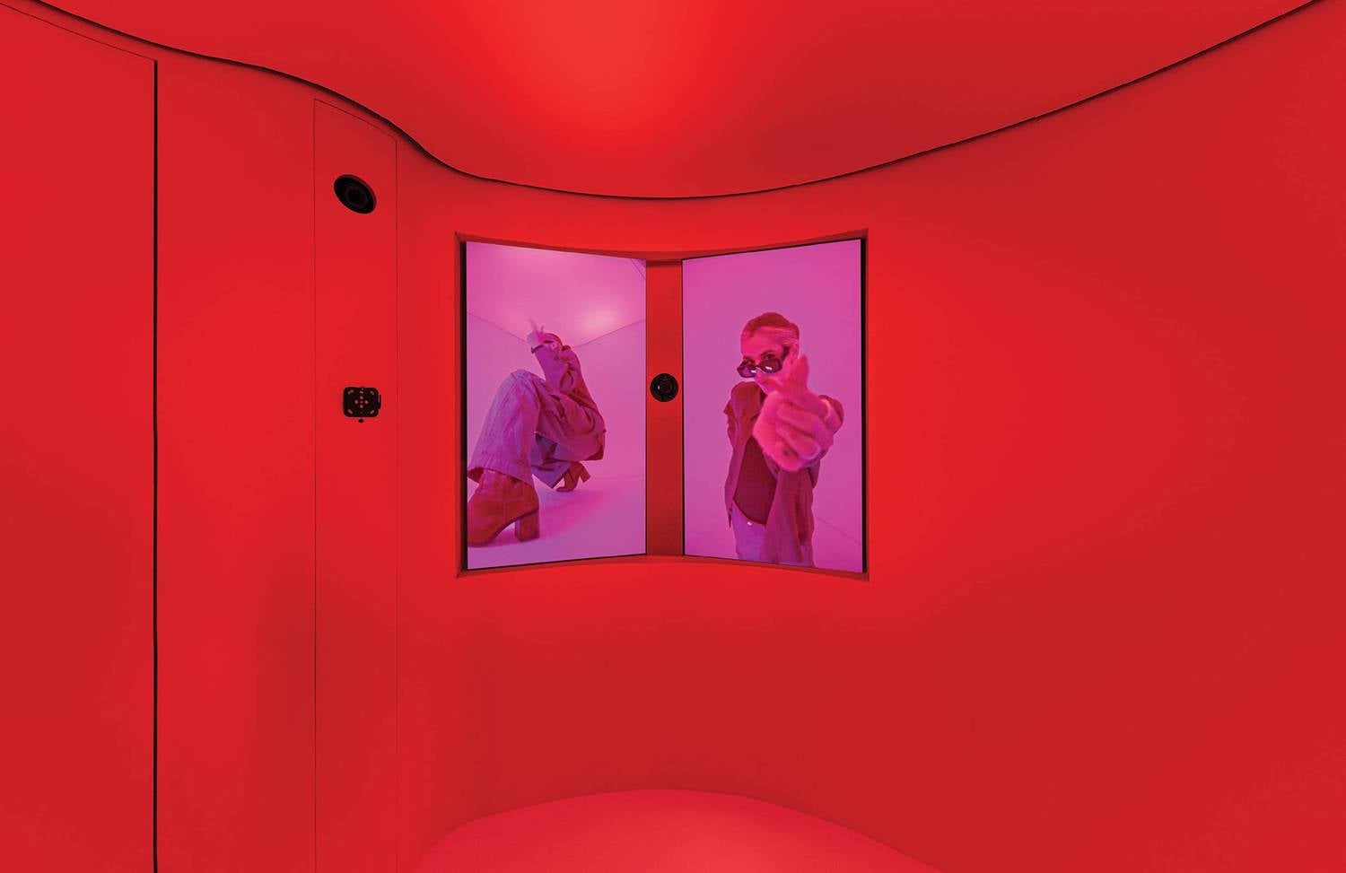A red room with two mirrors and a red wall in ZARA