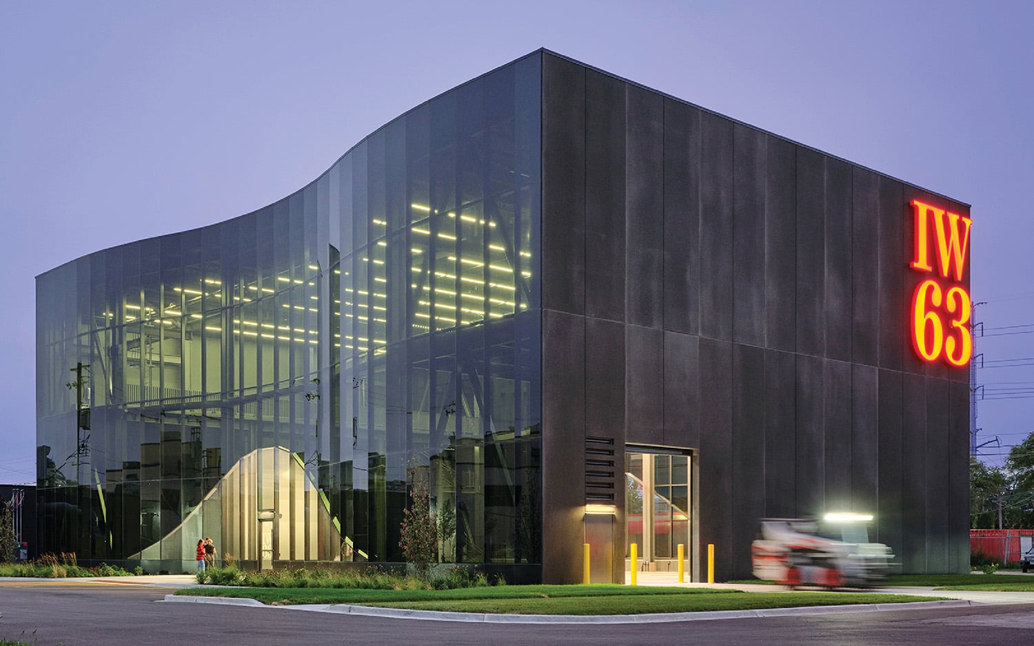 A building with a neon sign on the side of it