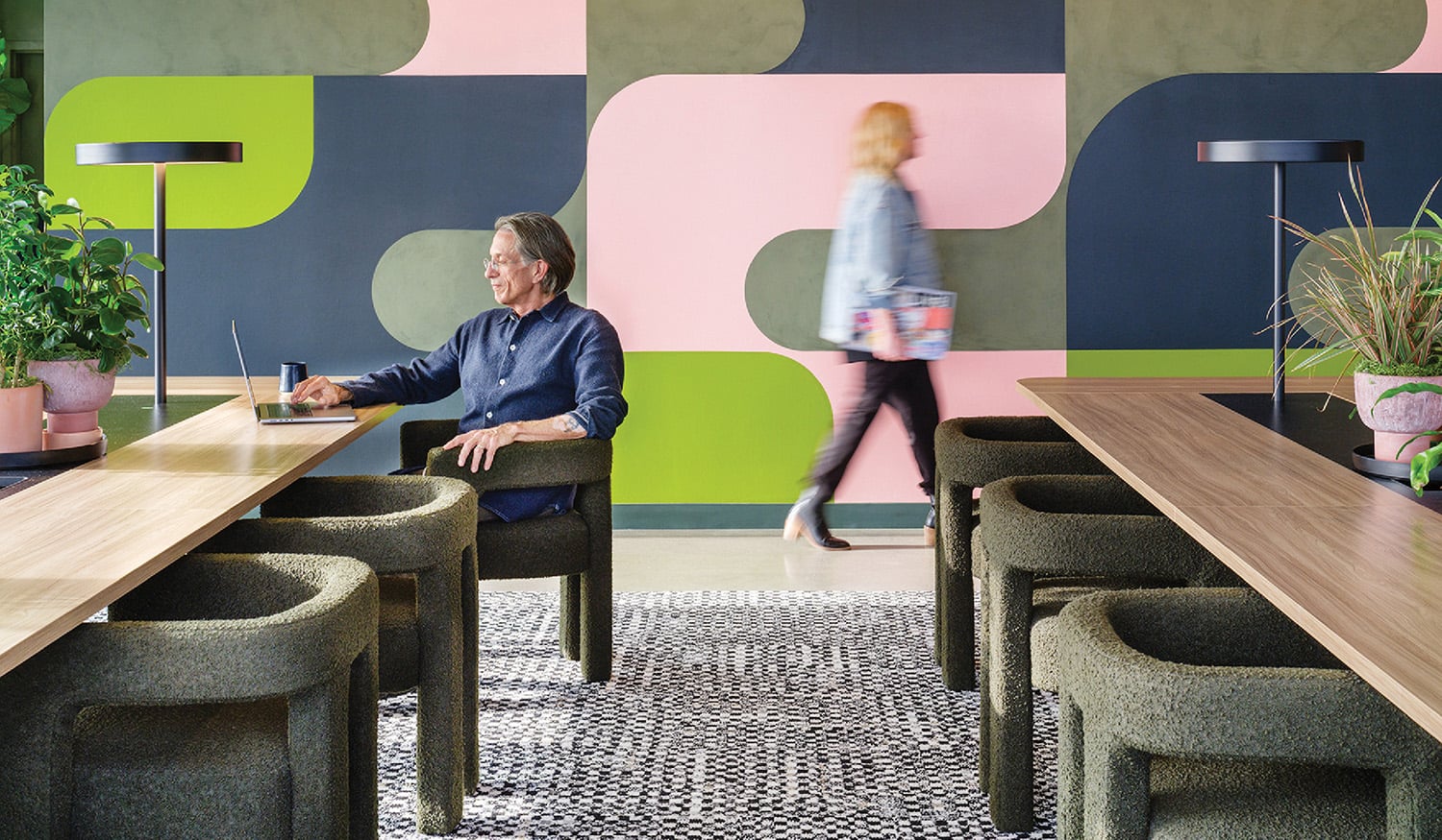 A woman sitting at a table in a room