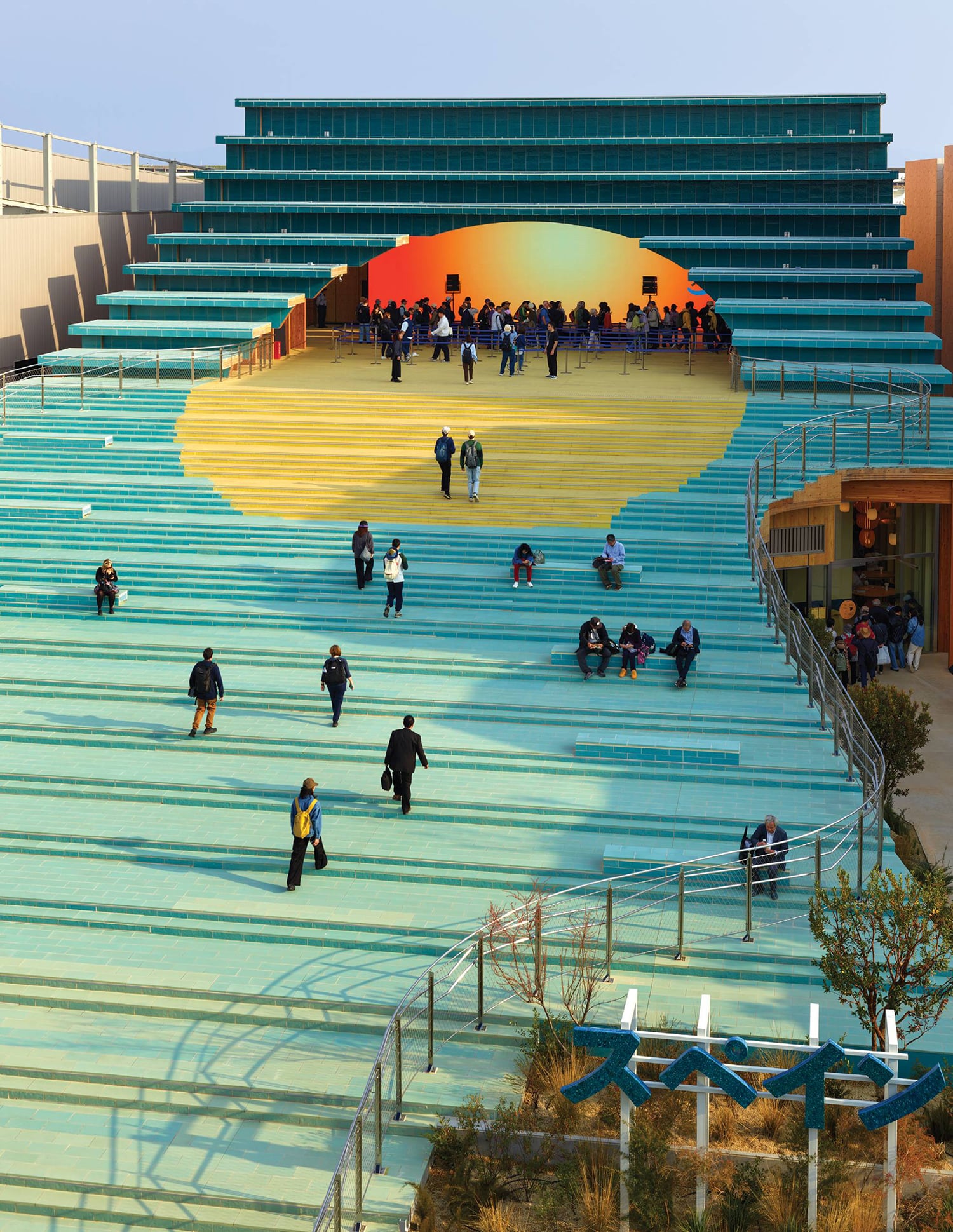 A group of people walking up a set of stairs