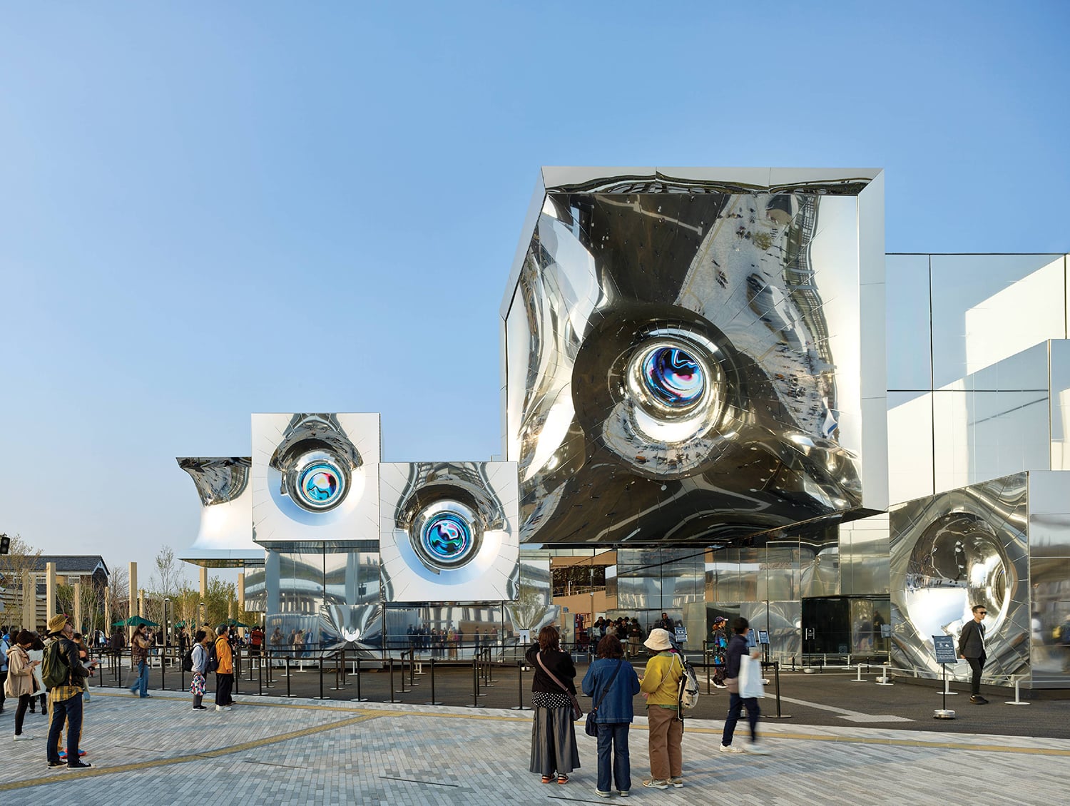 A group of people standing around a building