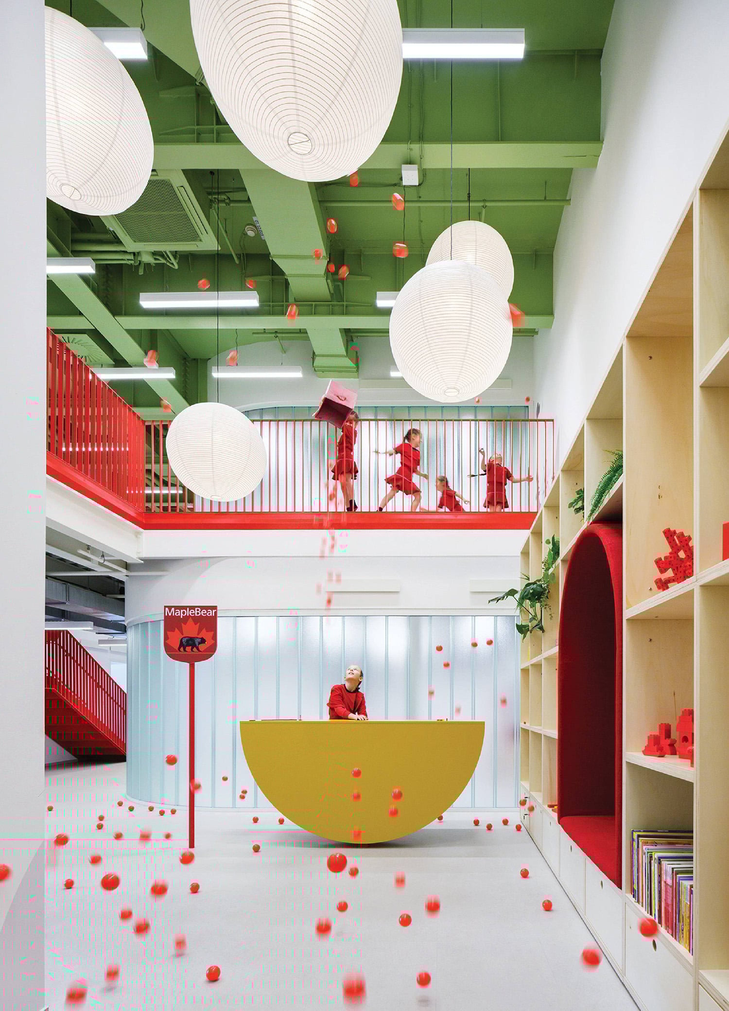 A room with a yellow tub and a red chair