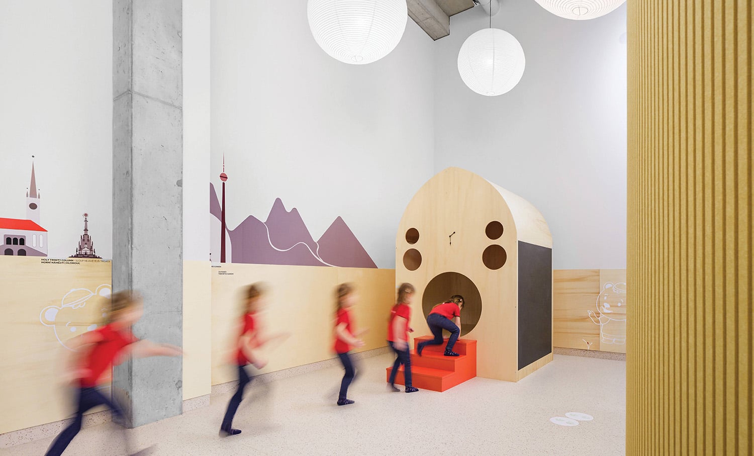 A group of people walking around a room