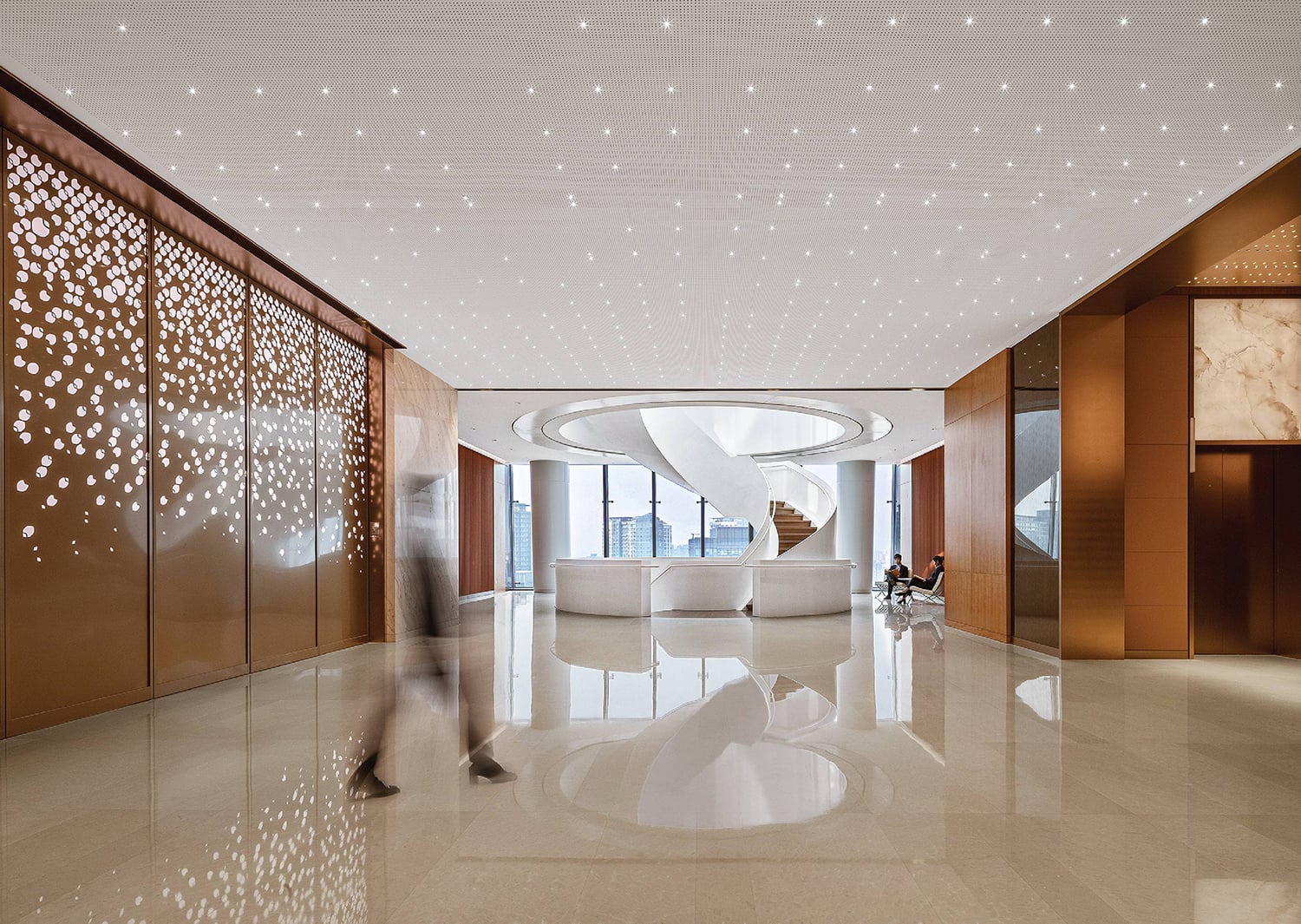 A large white lobby with a large white sculpture.
