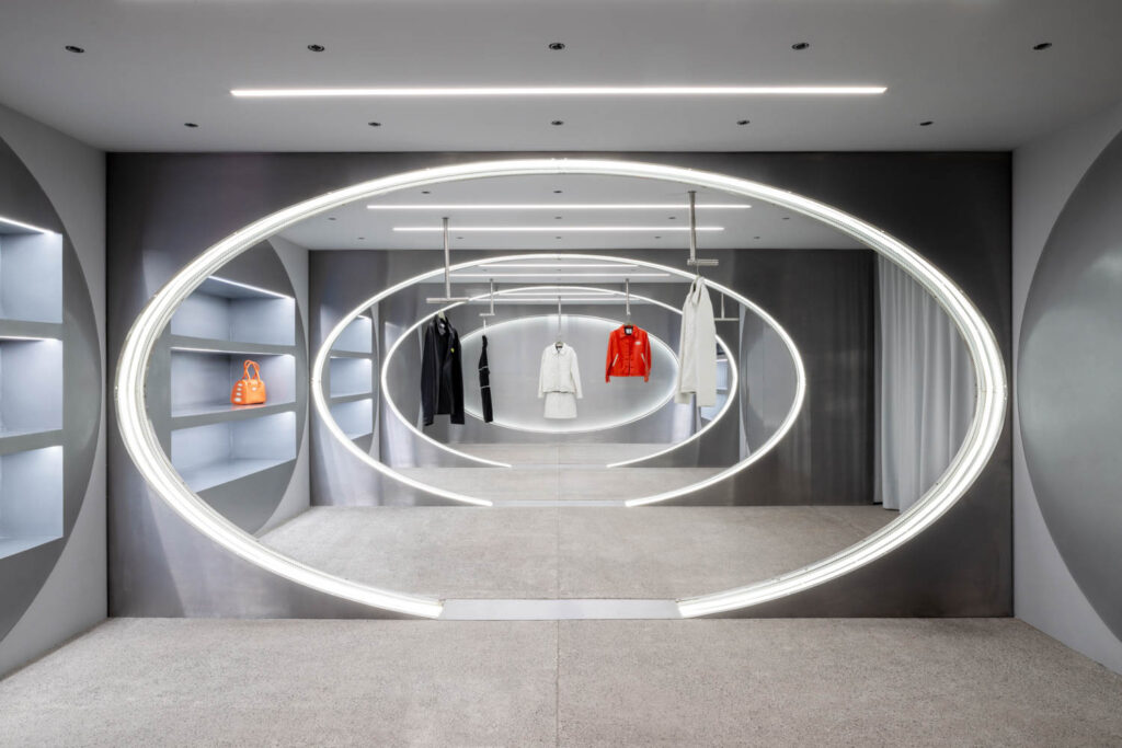 view of multiple shelves with clothing
