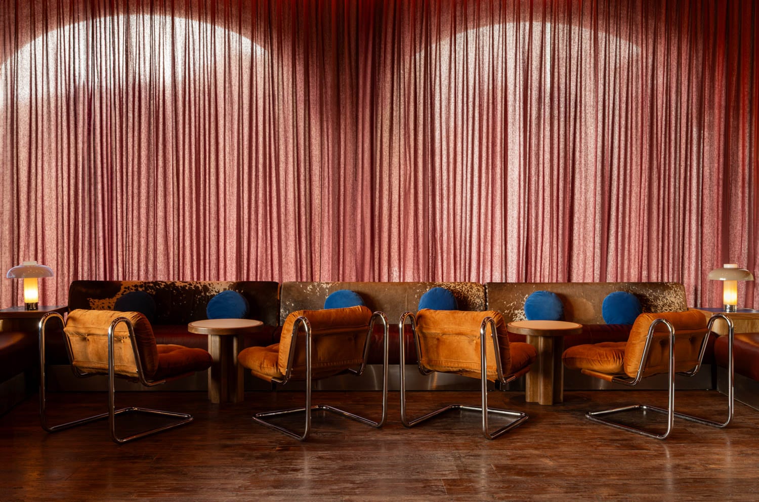 seating area with red curtains
