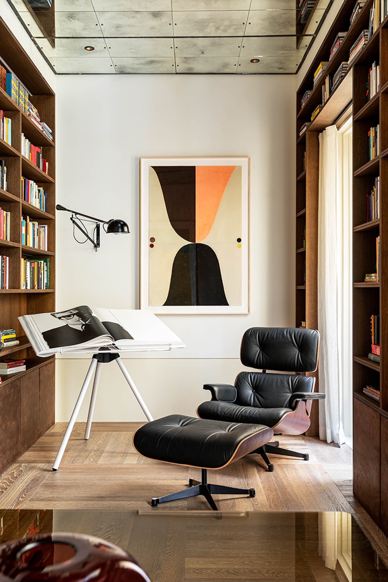 library reading nook with black chair