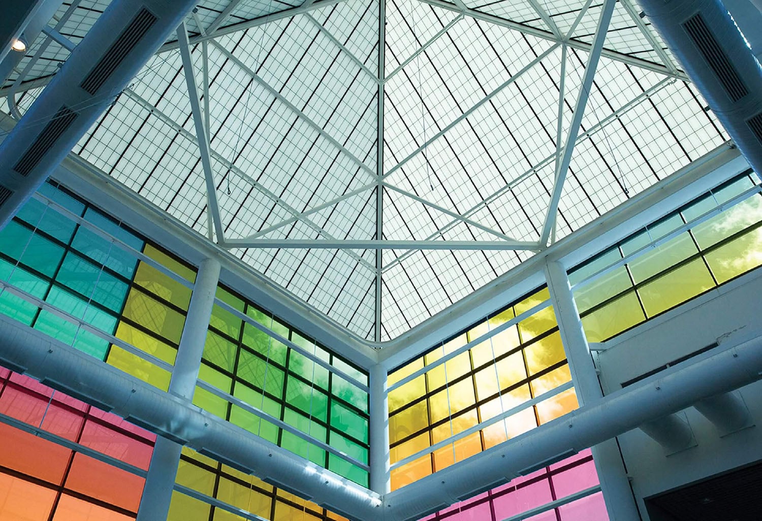 A large glass ceiling with multiple colored panels.