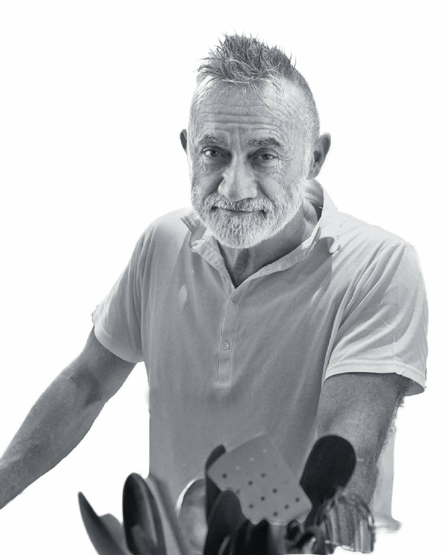 A man with a beard and a white shirt.