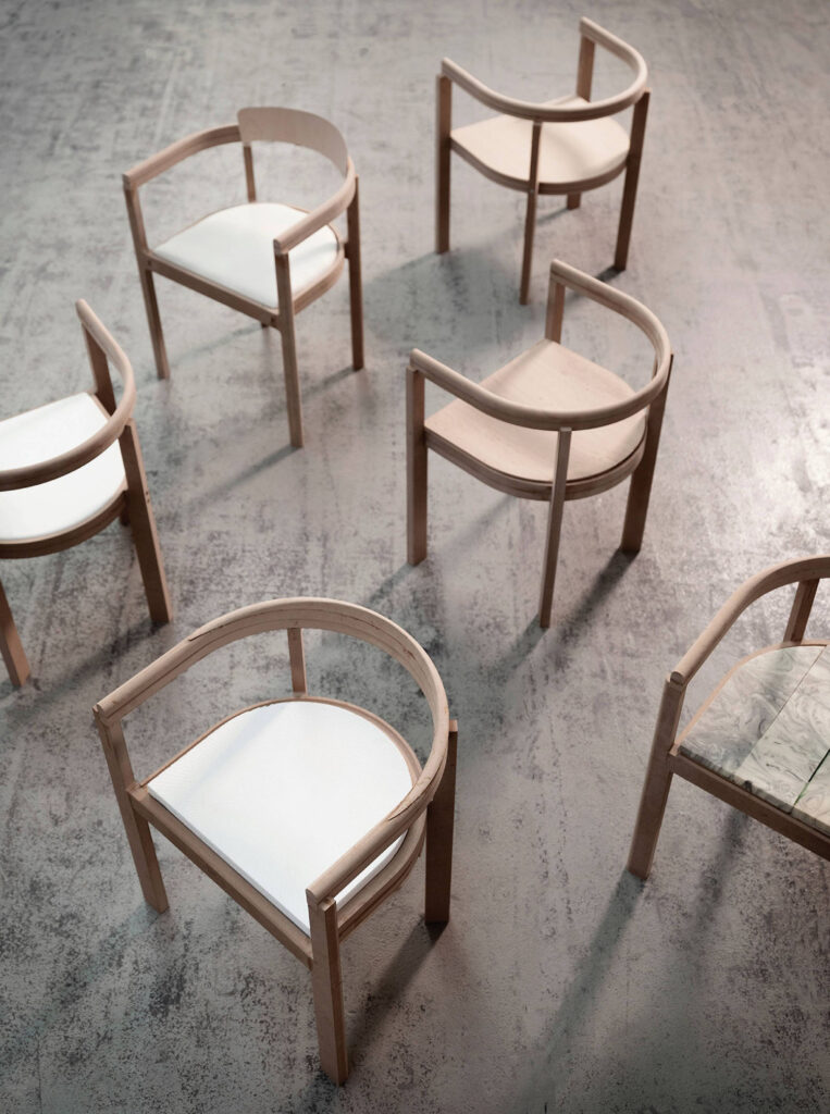 A group of chairs sitting on top of a cement floor.
