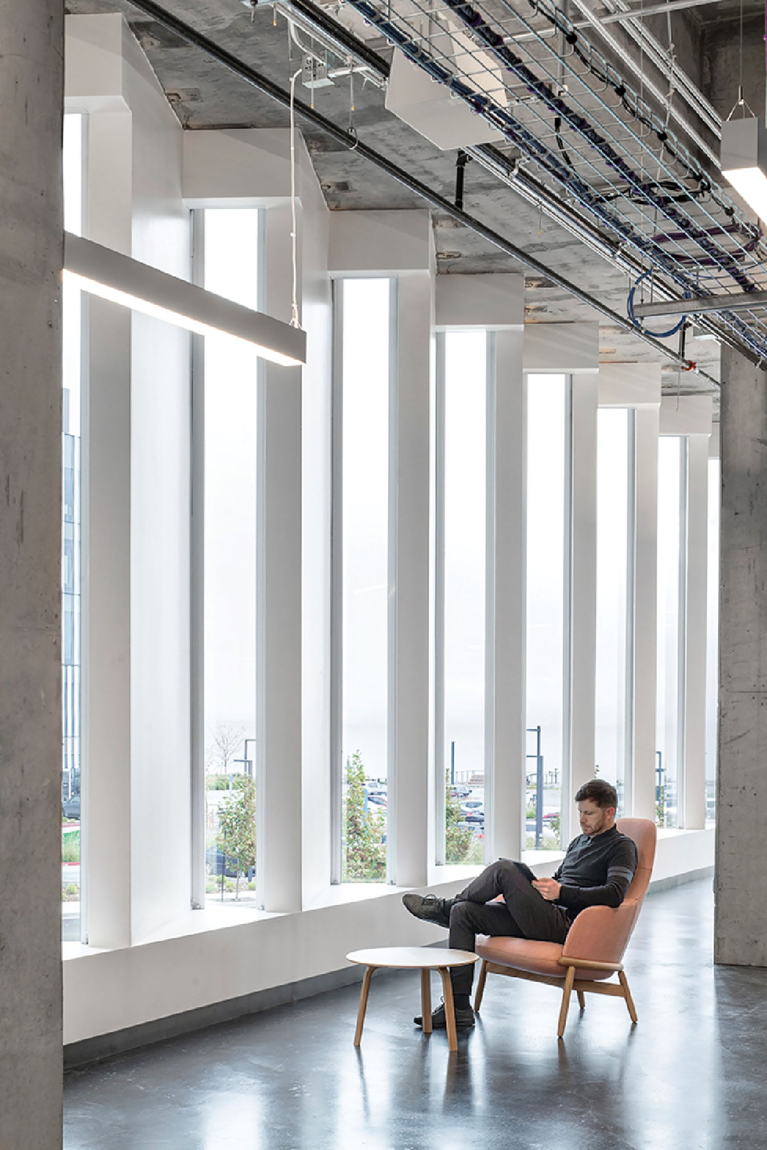A man sitting in a chair in a large room