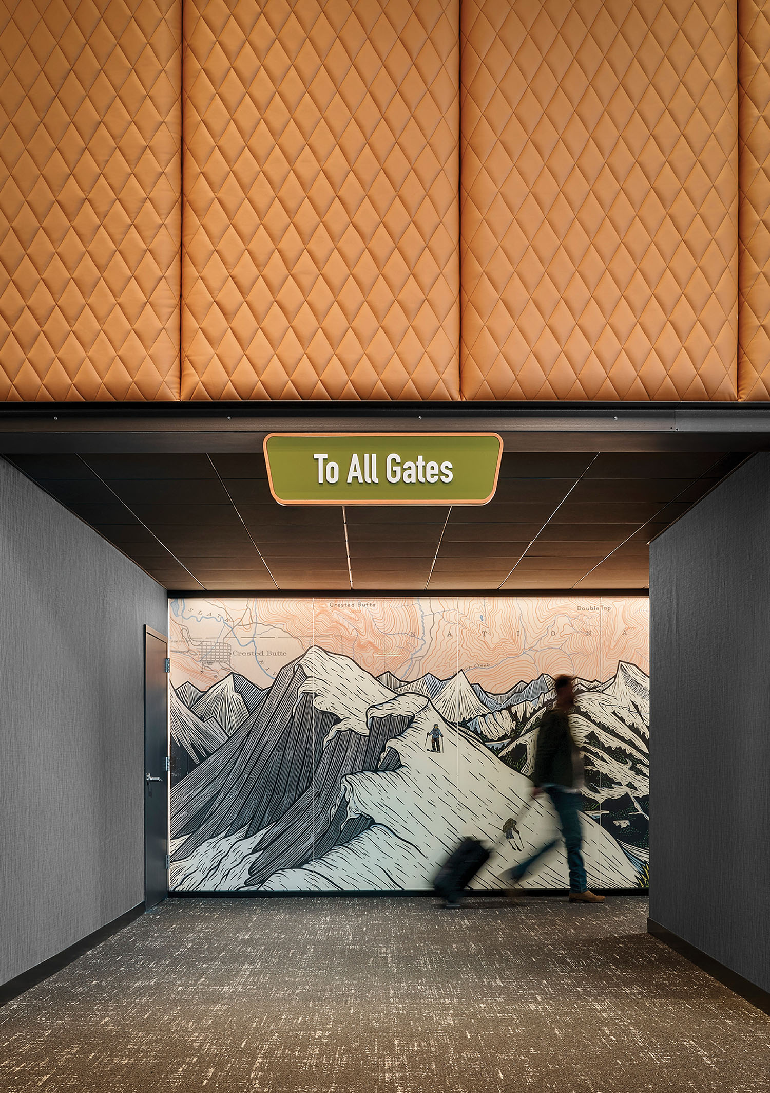 A man is walking through a tunnel