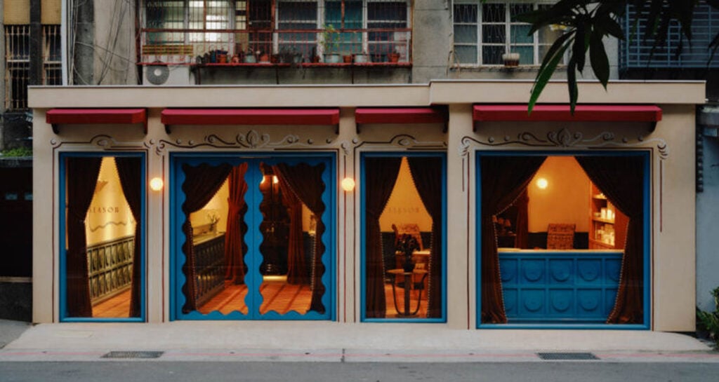 exterior of french bakery with blue trim at dusk