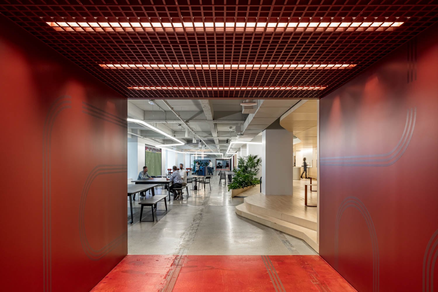 all red hallway leading to an office space