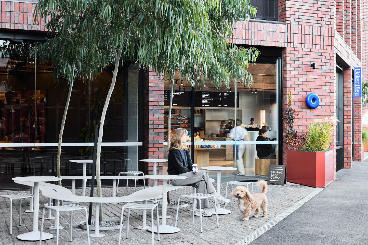 outdoor seating with a woman and dog