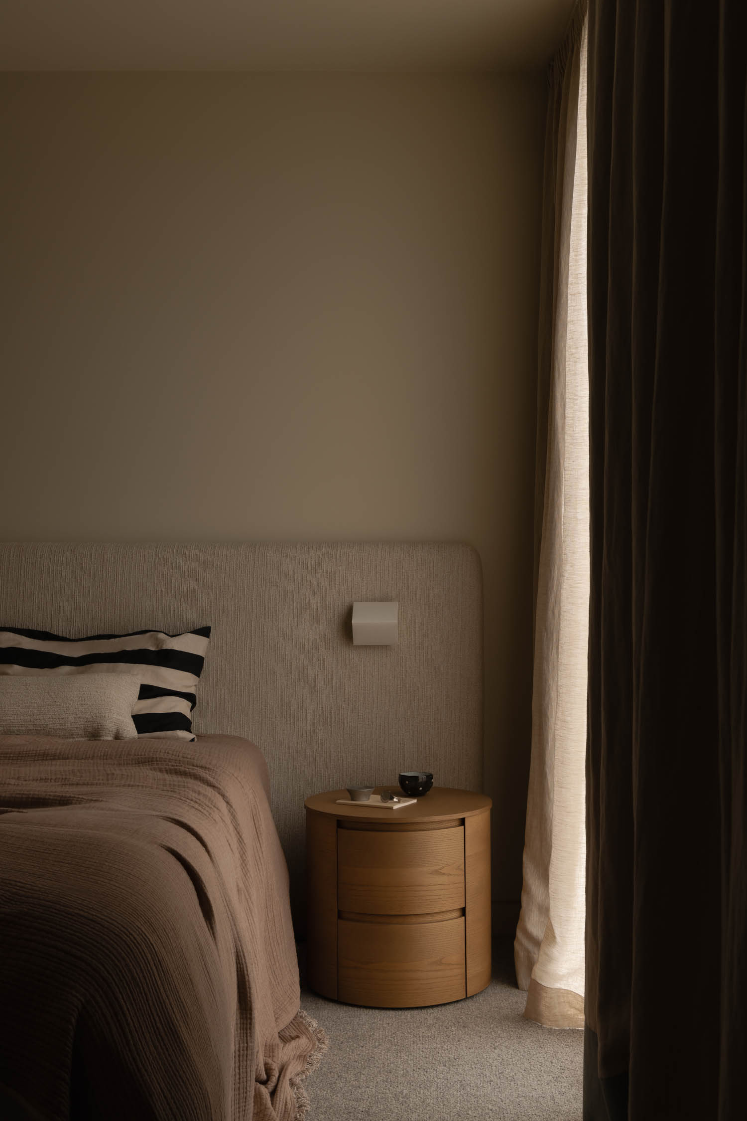 bedroom nook with brown sheets